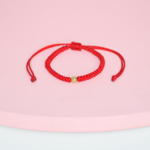 Pulsera protectora tejida con billa Oro