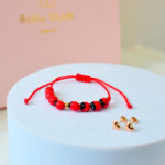 Pack Newborn Corazón clásico oro y pulsera de huayruros